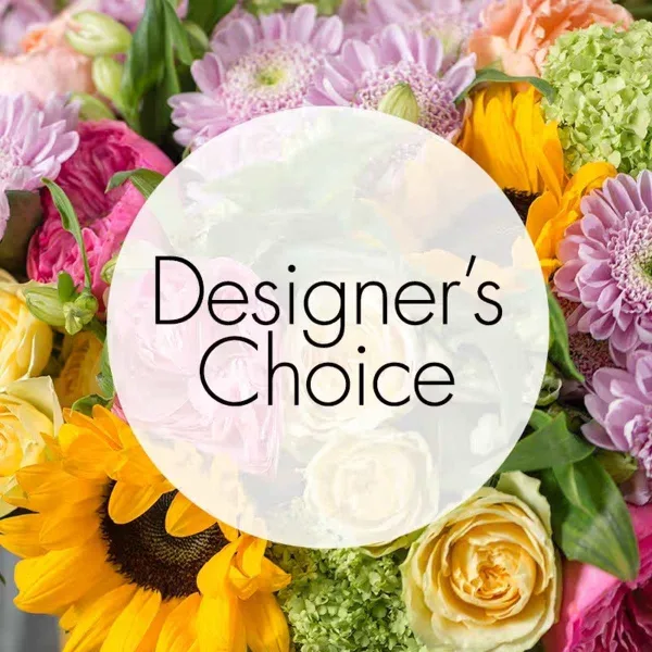 A close-up of a colorful floral arrangement with sunflowers, pink and purple daisies, and roses, featuring a 'Designer's Choice' text overlay.