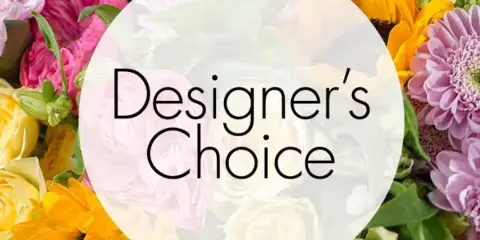 A close-up of a colorful floral arrangement with sunflowers, pink and purple daisies, and roses, featuring a 'Designer's Choice' text overlay.