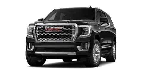 A black GMC Yukon SUV photographed against a black background.