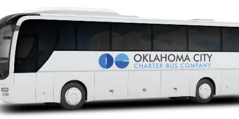 A white full-size charter bus with the Oklahoma City Charter Bus Company logo and text on the side.