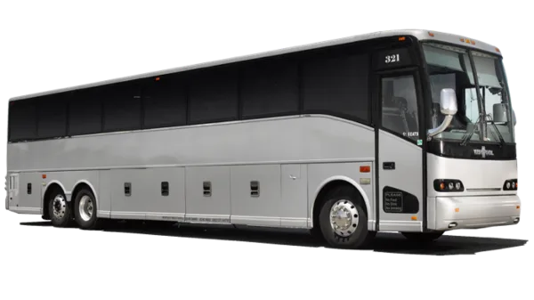 A white and silver large coach bus parked on a paved surface.