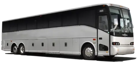 A white and silver large coach bus parked on a paved surface.