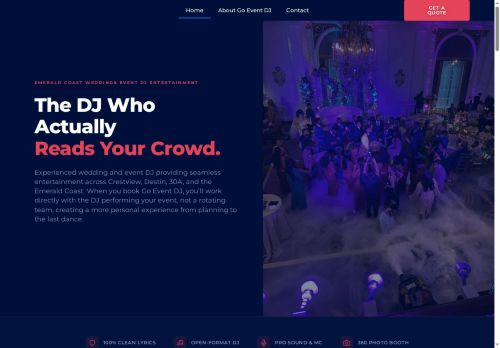 A crowded dance floor at a wedding or event with purple and blue lighting effects.