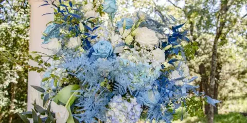 Blue and white wedding floral centerpiece by Queens Floral Design