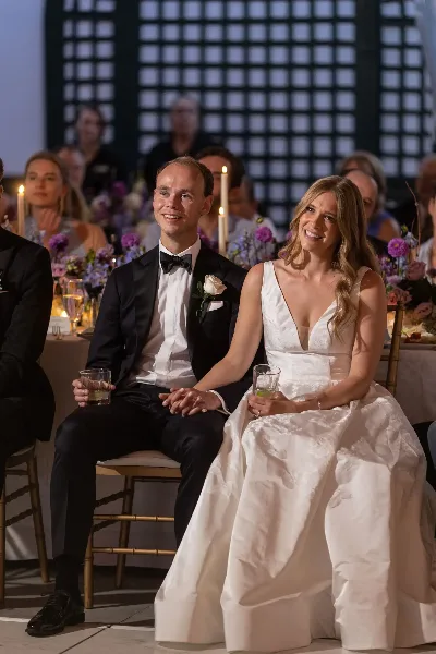 Wedding couple seated and smiling, Debbie Hart Celebrations, Syosset New York