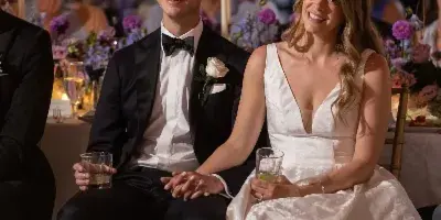 Wedding couple seated and smiling, Debbie Hart Celebrations, Syosset New York