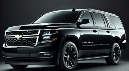 A black Chevrolet Suburban SUV parked against a dark background.