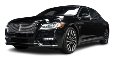 A black luxury sedan, likely a Lincoln Continental, photographed against a black background.