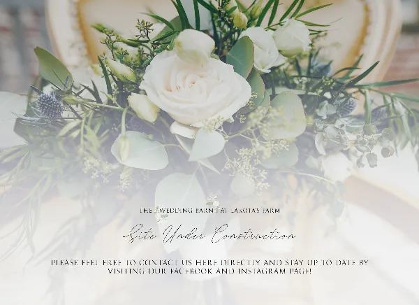 A close-up photograph of a wedding floral arrangement featuring white roses, eucalyptus leaves, and thistle flowers.