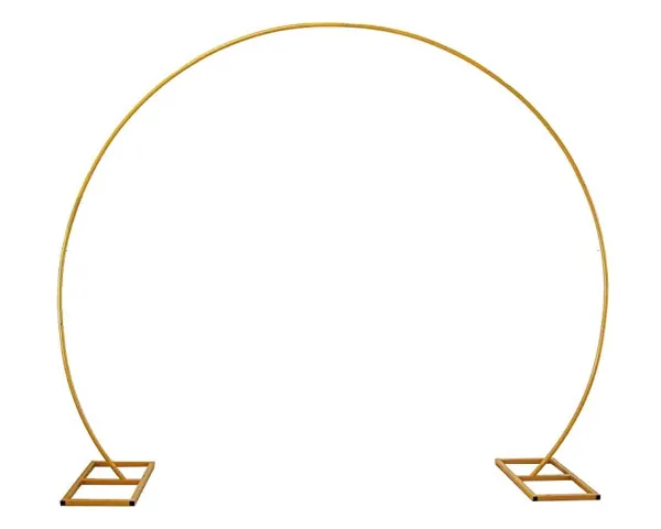 A gold metal wedding arch with a circular design and square bases.