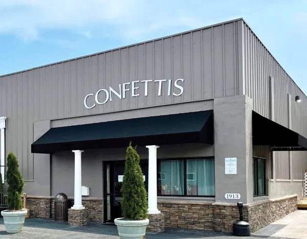 Exterior view of the Confetti's Event Center building with signage and address number 1913.