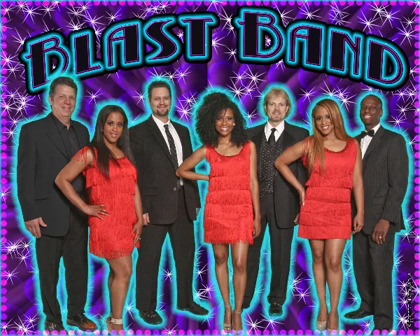 Group photo of seven musicians in formal performance attire standing in a line.