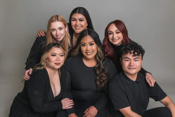 A group portrait of the Jasmine & Co. bridal hair and makeup team.