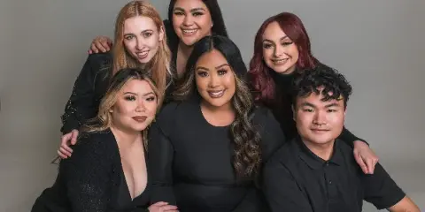A group portrait of the Jasmine & Co. bridal hair and makeup team.
