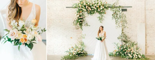 A bride holding a bouquet of white and peach roses next to a floral archway installation.