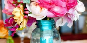 Mason jar wedding centerpiece by Lynn's Floral Design