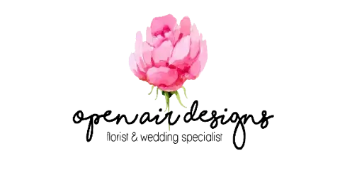 A single pink flower with a green stem on a black background