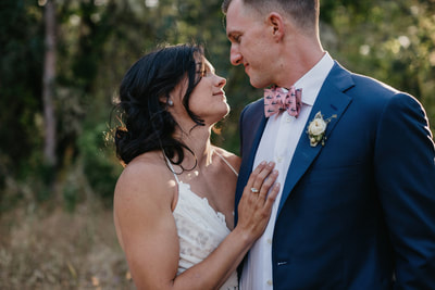 A bride and groom looking at each other during a wedding.