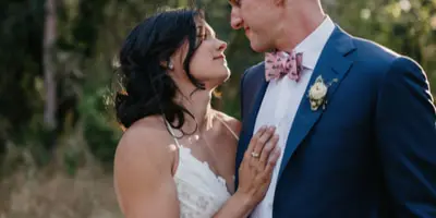 A bride and groom looking at each other during a wedding.