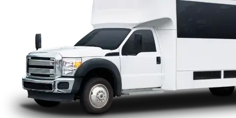 A white shuttle van parked outdoors.