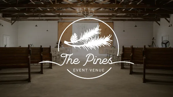 Interior view of a rustic event venue with wooden pews and exposed ceiling beams, overlaid with the 'The Pines Event Venue' logo.