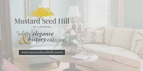 Interior view of a historic estate room featuring a cream sofa, floral arrangements, and elegant decor.