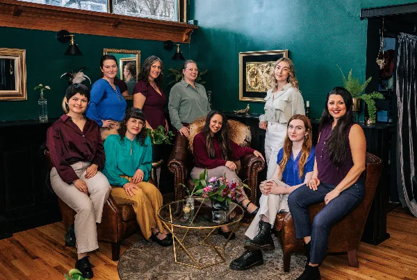 Group portrait of the Gala Events and Weddings planning team in a studio setting.