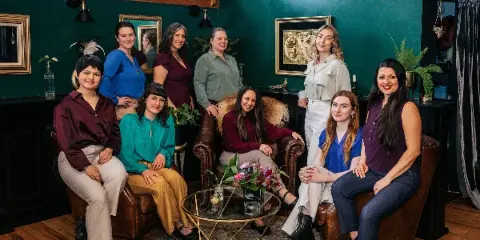 Group portrait of the Gala Events and Weddings planning team in a studio setting.