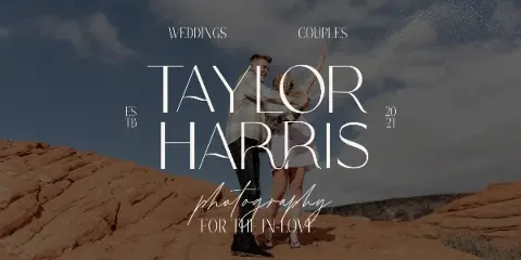 A wedding couple dancing joyfully on a rocky outcrop under a blue sky, with the text 'Taylor Harris Photography' overlaid.