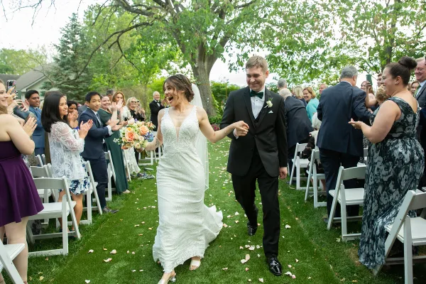 A bride and groom run down the aisle after their wedding ceremony Rockland County Wedding Photographer