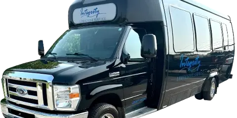 A black Ford shuttle bus with Integrity Limousine Service branding on the side and front.