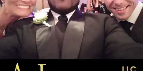 Three people in formal wedding attire smiling together at a reception, with the A Luxury LLC logo overlaid at the bottom.