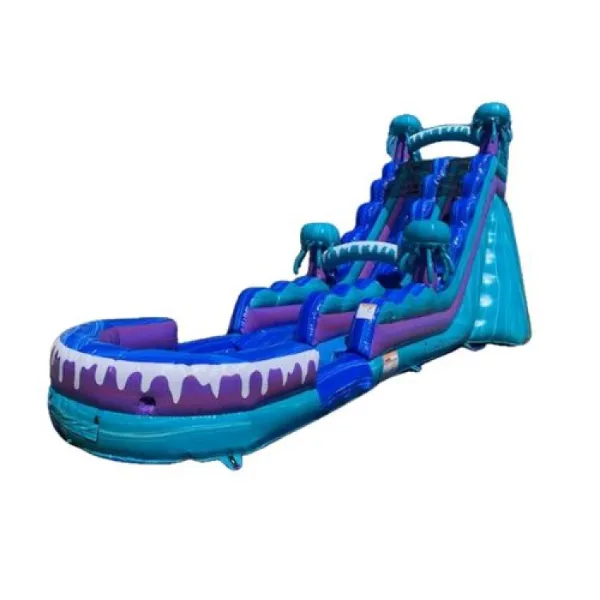 A large, blue and purple inflatable water slide with a shark mouth design at the base.