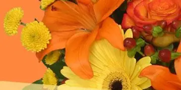 A close-up photograph of a floral arrangement featuring orange lilies, yellow chrysanthemums, and roses, labeled 'Fall Florals Designer's Choice'.