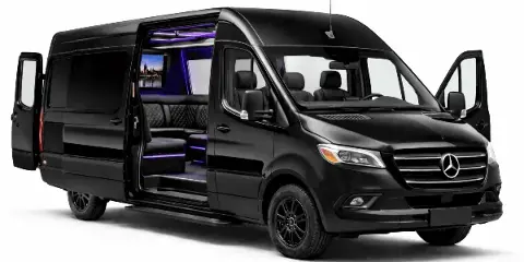 Black Mercedes Sprinter van with open side door revealing a luxury interior with purple mood lighting and leather seating.