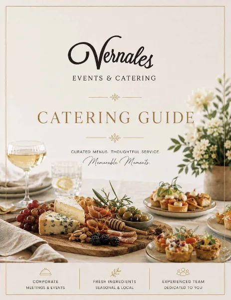 A catering guide cover featuring a wooden board with cheese, cured meats, grapes, and olives, alongside small appetizer tarts and a glass of white wine.