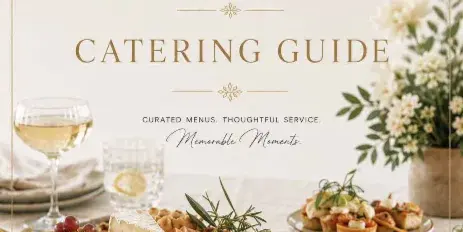 A catering guide cover featuring a wooden board with cheese, cured meats, grapes, and olives, alongside small appetizer tarts and a glass of white wine.