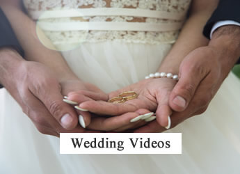 Close-up of a bride and groom exchanging wedding rings.