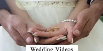 Close-up of a bride and groom exchanging wedding rings.