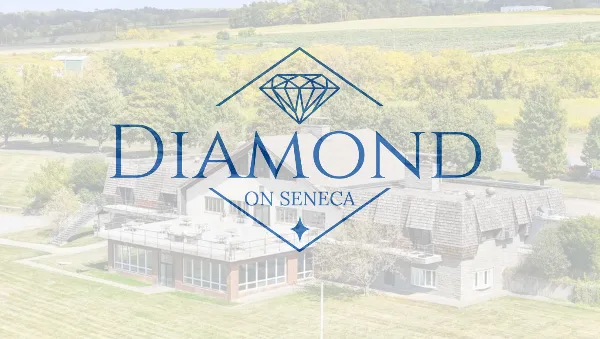 Aerial view of the Diamond on Seneca venue building with a large logo overlay