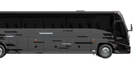 Side profile of a black charter bus