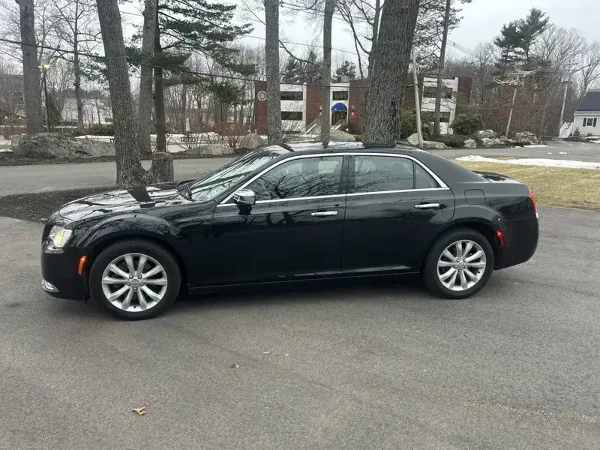 Black Chrysler 300 luxury sedan parked on a street