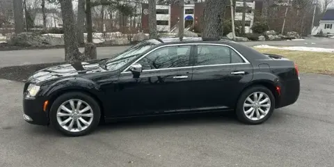 Black Chrysler 300 luxury sedan parked on a street