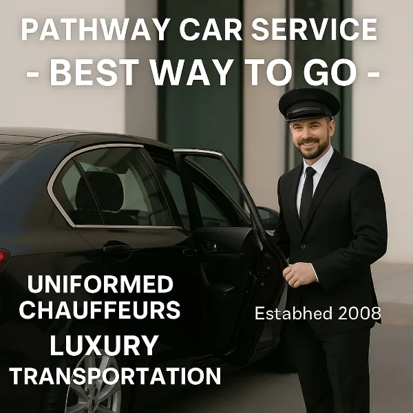 A uniformed chauffeur in a black suit and hat stands next to a black luxury sedan with the door open.