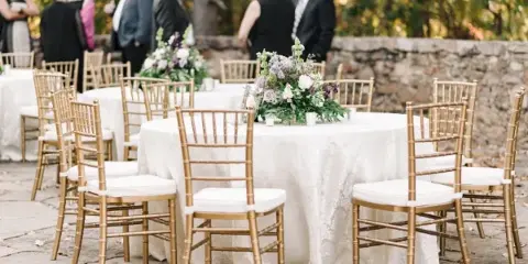 Gold chiavari chairs at an outdoor wedding reception by Alabama Event Rentals