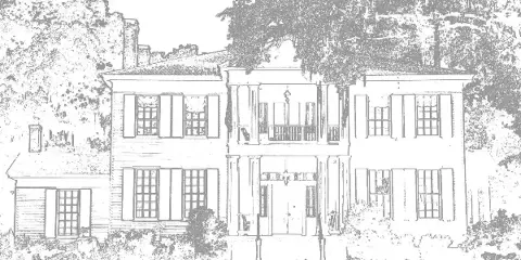 Exterior view of a two-story Greek revival style mansion with a central columned porch and surrounding trees.