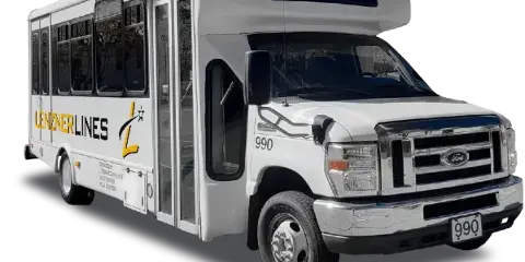 A white Lenzner Lines minibus parked on a street.
