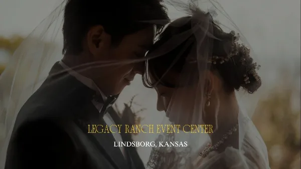 A bride and groom touching foreheads under a veil in an outdoor setting.