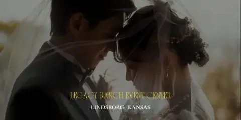A bride and groom touching foreheads under a veil in an outdoor setting.