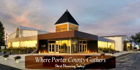 Exterior view of the Porter County Expo Center building at dusk, featuring a central tower and large glass entrance.